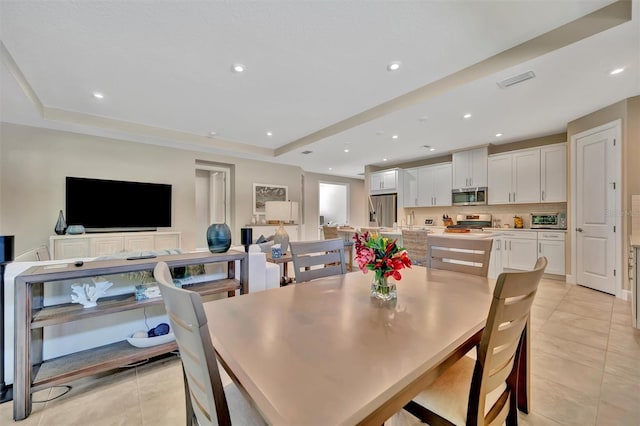 5320 Morey Farms Loop, Palmetto, FL 34221 - dining space featuring light tile patterned floors, recessed lighting, and a raised ceiling