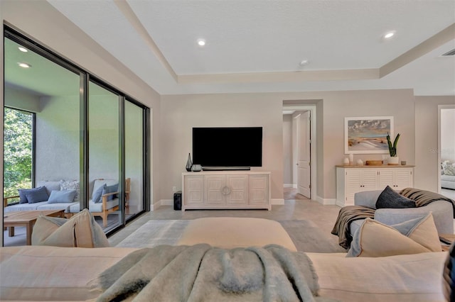 5320 Morey Farms Loop, Palmetto, FL 34221 - living area featuring a raised ceiling, recessed lighting, and light wood finished floors