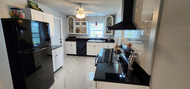 1583 Eunice Ln, Clearwater, FL 33756 - kitchen featuring wall chimney range hood, black appliances, dark countertops, light marble finish flooring, and glass insert cabinets