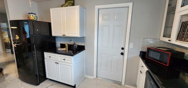 1583 Eunice Ln, Clearwater, FL 33756 - kitchen with black appliances, light marble finish floors, white cabinetry, and decorative backsplash