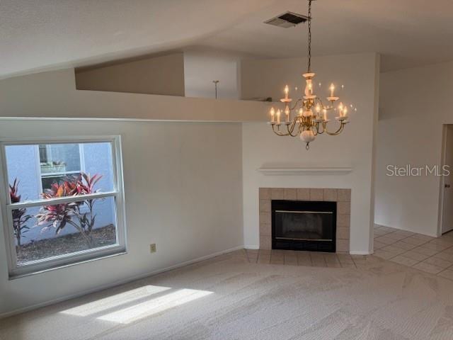 1922 Blue Sage Ct, Brandon, FL 33511 - unfurnished living room featuring a chandelier, light carpet, lofted ceiling, a tiled fireplace, and light tile patterned floors