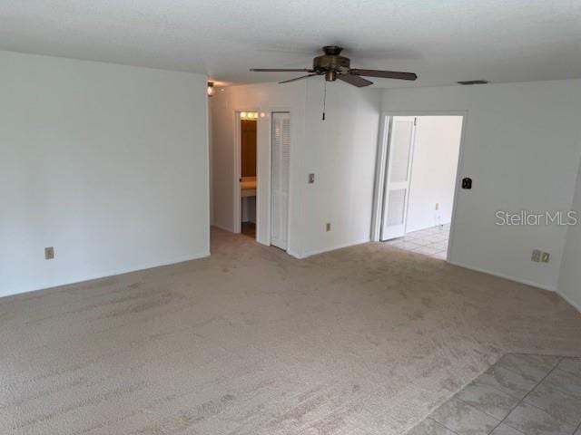 1922 Blue Sage Ct, Brandon, FL 33511 - spare room with a ceiling fan and light carpet