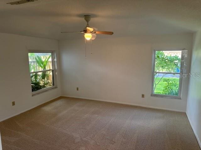 1922 Blue Sage Ct, Brandon, FL 33511 - unfurnished room with healthy amount of natural light, light carpet, and a ceiling fan