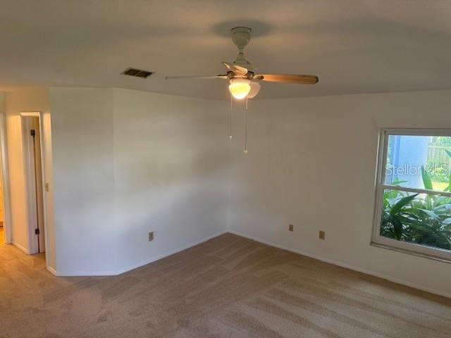 1922 Blue Sage Ct, Brandon, FL 33511 - empty room featuring light carpet and ceiling fan