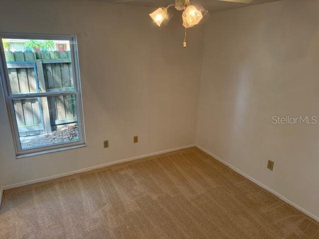 1922 Blue Sage Ct, Brandon, FL 33511 - spare room featuring a ceiling fan and light carpet