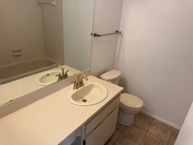 1922 Blue Sage Ct, Brandon, FL 33511 - bathroom with vanity, tile patterned floors, and shower / bath combination