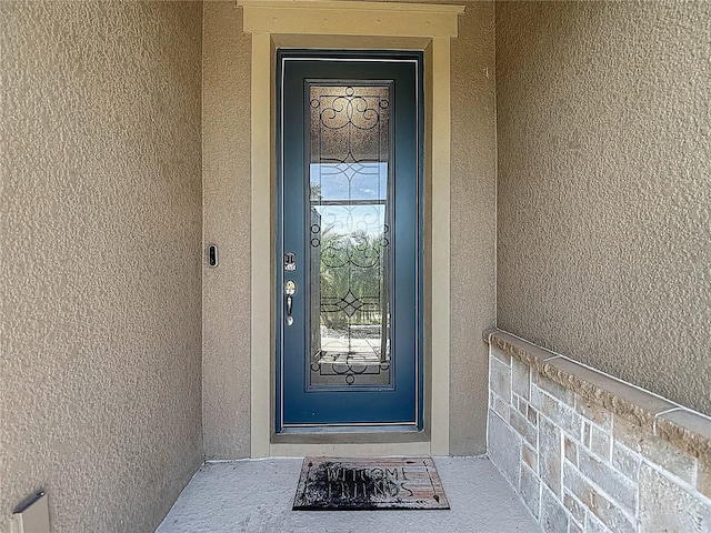 11703 Brighton Knoll Loop, Riverview, FL 33579 - view of exterior entry featuring stucco siding
