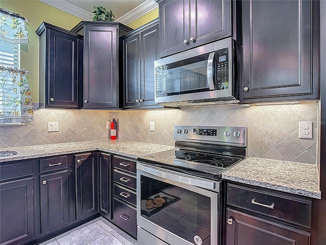 11703 Brighton Knoll Loop, Riverview, FL 33579 - kitchen featuring appliances with stainless steel finishes, ornamental molding, light stone countertops, backsplash, and light tile patterned flooring