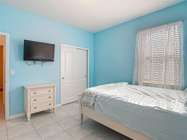 11703 Brighton Knoll Loop, Riverview, FL 33579 - bedroom with light tile patterned floors and a closet