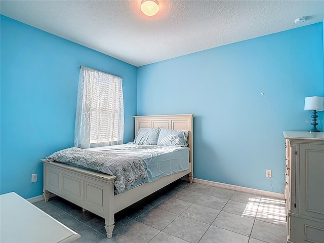 11703 Brighton Knoll Loop, Riverview, FL 33579 - tiled bedroom with baseboards and a textured ceiling