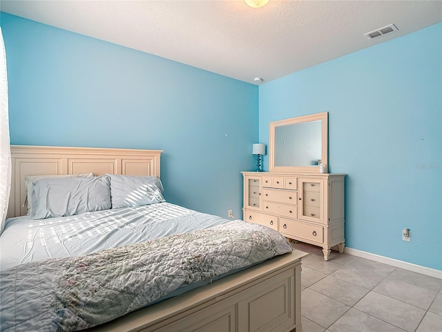 11703 Brighton Knoll Loop, Riverview, FL 33579 - bedroom with light tile patterned floors and baseboards