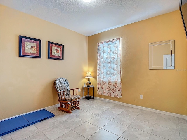 11703 Brighton Knoll Loop, Riverview, FL 33579 - sitting room featuring a textured ceiling and tile patterned floors