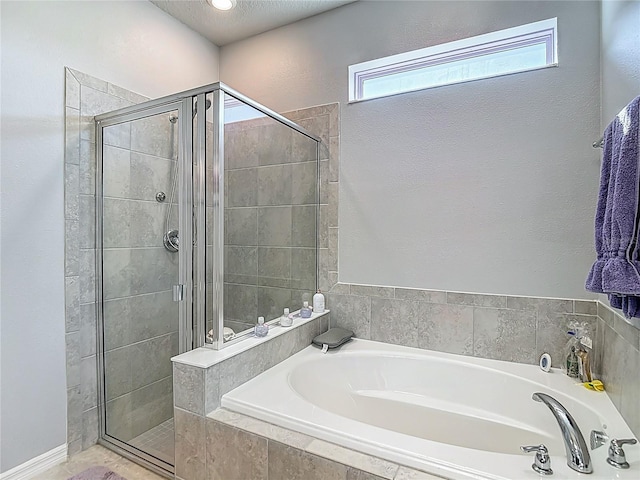 11703 Brighton Knoll Loop, Riverview, FL 33579 - bathroom featuring a bath and a shower stall