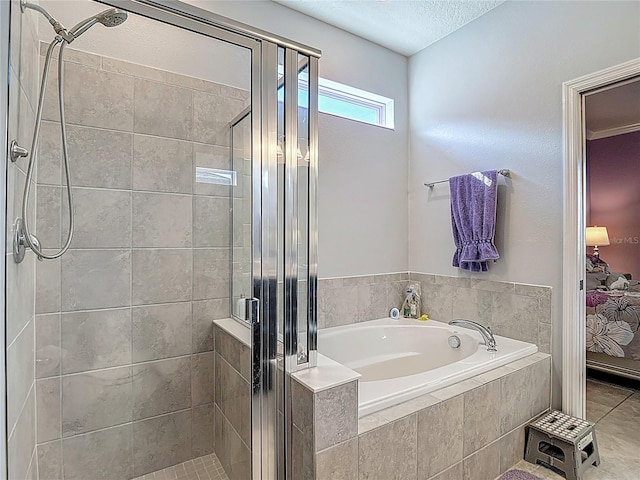11703 Brighton Knoll Loop, Riverview, FL 33579 - full bath featuring a bath, a stall shower, and a textured ceiling