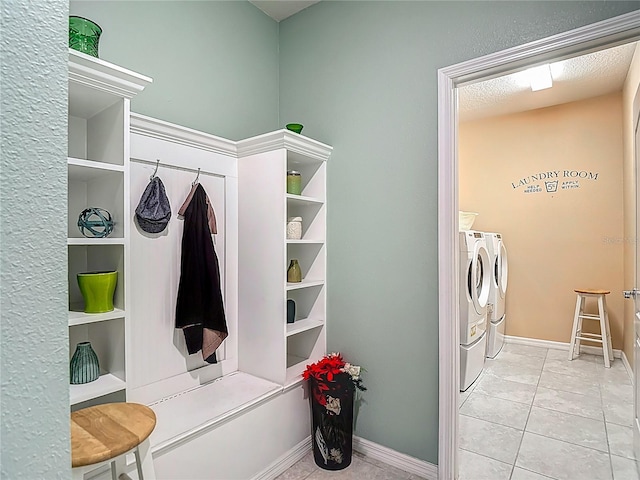 11703 Brighton Knoll Loop, Riverview, FL 33579 - mudroom featuring washing machine and clothes dryer and tile patterned flooring