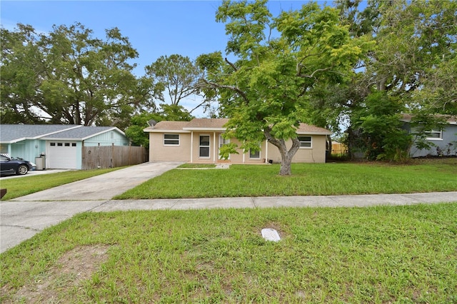 1116 Jadewood Ave, Clearwater, FL 33759 - view of front facade featuring driveway and stucco siding