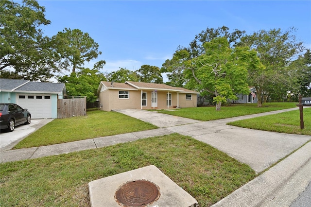 1116 Jadewood Ave, Clearwater, FL 33759 - ranch-style home with an attached garage, stucco siding, and driveway