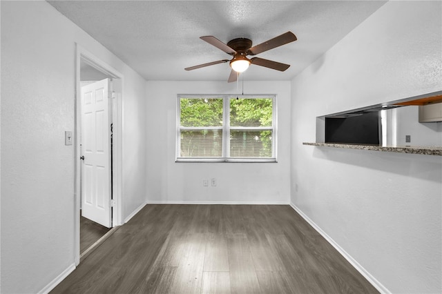 1116 Jadewood Ave, Clearwater, FL 33759 - empty room with wood finished floors, ceiling fan, and a textured ceiling