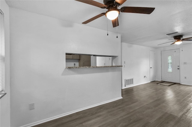 1116 Jadewood Ave, Clearwater, FL 33759 - unfurnished living room with ceiling fan and dark wood-type flooring