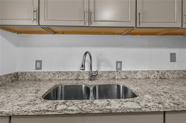 1116 Jadewood Ave, Clearwater, FL 33759 - kitchen view of gray cabinetry and light stone counters
