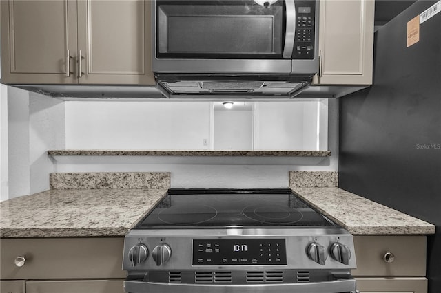 1116 Jadewood Ave, Clearwater, FL 33759 - kitchen featuring appliances with stainless steel finishes and gray cabinets