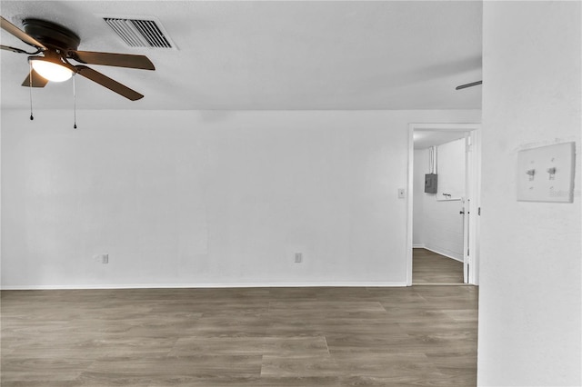 1116 Jadewood Ave, Clearwater, FL 33759 - empty room with ceiling fan and wood finished floors
