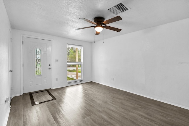 1116 Jadewood Ave, Clearwater, FL 33759 - foyer featuring a ceiling fan, dark wood finished floors, and a textured ceiling