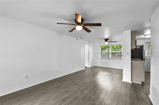 1116 Jadewood Ave, Clearwater, FL 33759 - unfurnished living room featuring ceiling fan and dark wood-type flooring