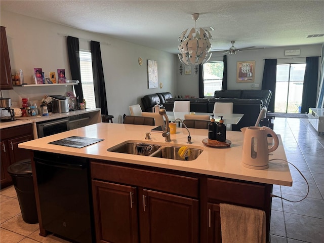10108 Rosemary Leaf Ln, Riverview, FL 33578 - kitchen with dishwashing machine, open floor plan, light countertops, healthy amount of natural light, and a textured ceiling