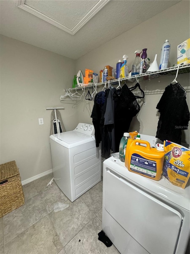 10108 Rosemary Leaf Ln, Riverview, FL 33578 - washroom with separate washer and dryer and a textured ceiling