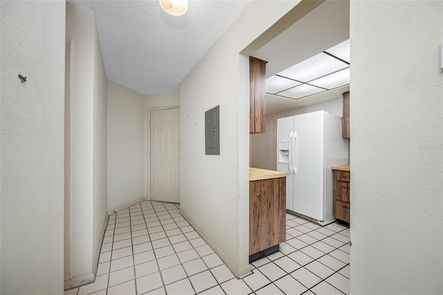 2131 Ridge Rd S Unit 19, Largo, FL 33778 - corridor featuring electric panel, light tile patterned floors, and a textured ceiling