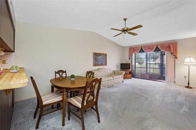2131 Ridge Rd S Unit 19, Largo, FL 33778 - dining room with ceiling fan, lofted ceiling, carpet floors, and a textured ceiling