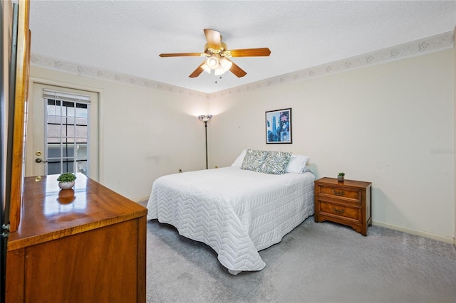 2131 Ridge Rd S Unit 19, Largo, FL 33778 - bedroom featuring light colored carpet, ceiling fan, and a textured ceiling