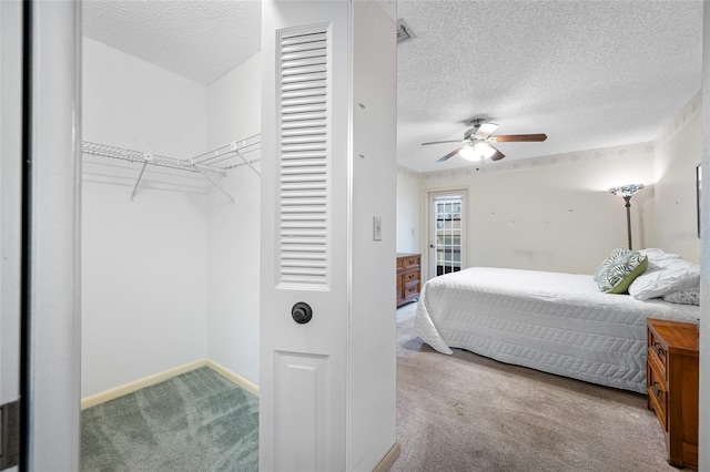 2131 Ridge Rd S Unit 19, Largo, FL 33778 - carpeted bedroom featuring a textured ceiling and ceiling fan