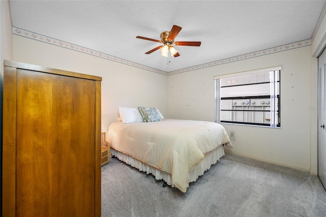 2131 Ridge Rd S Unit 19, Largo, FL 33778 - bedroom featuring carpet floors, a textured ceiling, and a ceiling fan