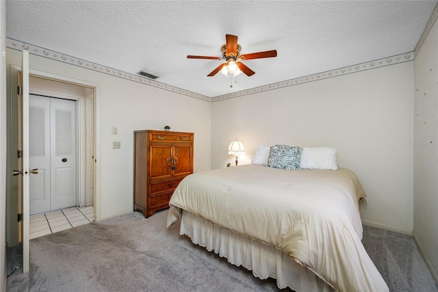 2131 Ridge Rd S Unit 19, Largo, FL 33778 - carpeted bedroom with a textured ceiling and ceiling fan