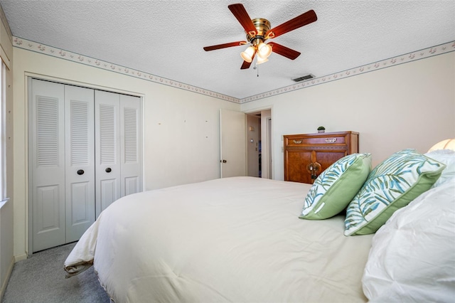 2131 Ridge Rd S Unit 19, Largo, FL 33778 - bedroom with a closet, a textured ceiling, carpet, and ceiling fan