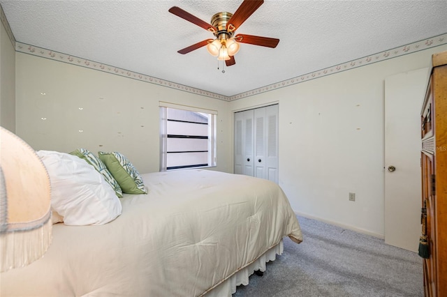 2131 Ridge Rd S Unit 19, Largo, FL 33778 - bedroom with carpet flooring, a closet, a textured ceiling, and a ceiling fan