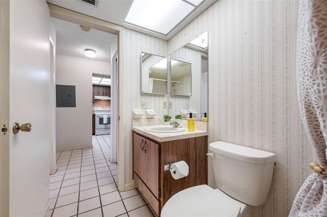 2131 Ridge Rd S Unit 19, Largo, FL 33778 - bathroom featuring electric panel, tile patterned floors, vanity, and wallpapered walls
