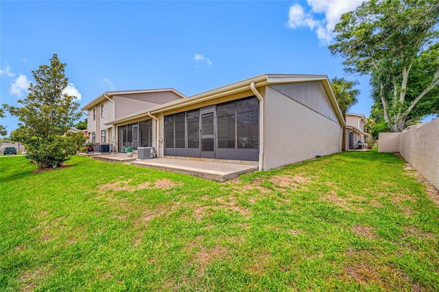 2131 Ridge Rd S Unit 19, Largo, FL 33778 - rear view of property featuring a sunroom, a patio area, and stucco siding