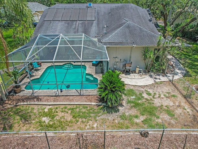 8711 Crescent Forest Blvd, New Port Richey, FL 34654 - swimming pool with a patio and glass enclosure