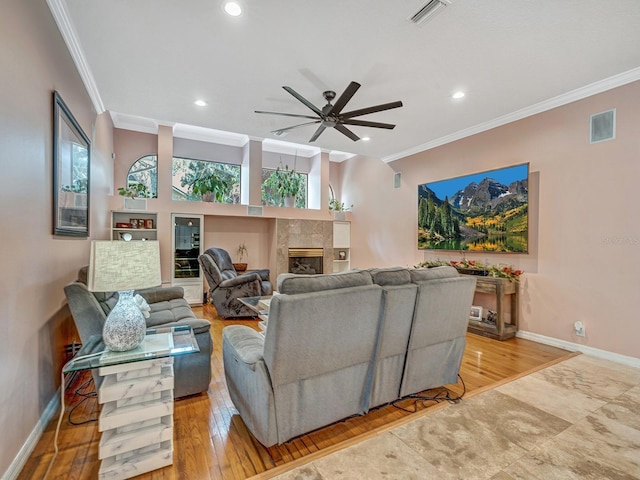 8711 Crescent Forest Blvd, New Port Richey, FL 34654 - living area featuring a ceiling fan, crown molding, a fireplace, recessed lighting, and wood finished floors