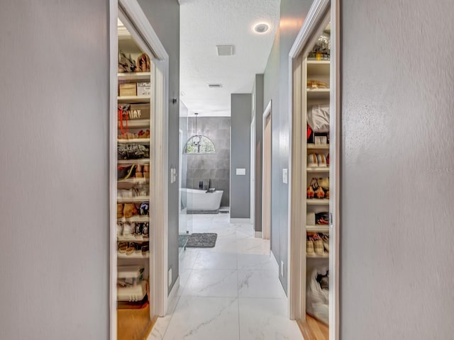 8711 Crescent Forest Blvd, New Port Richey, FL 34654 - hall with marble look tiles