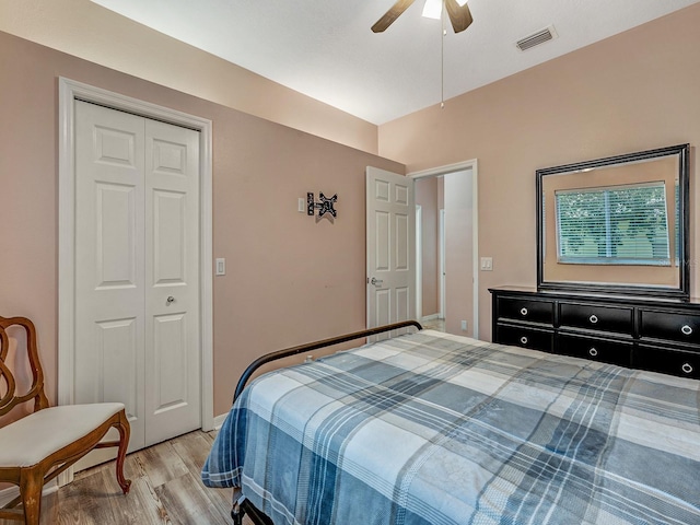 8711 Crescent Forest Blvd, New Port Richey, FL 34654 - bedroom featuring light wood-style floors, a closet, and a ceiling fan