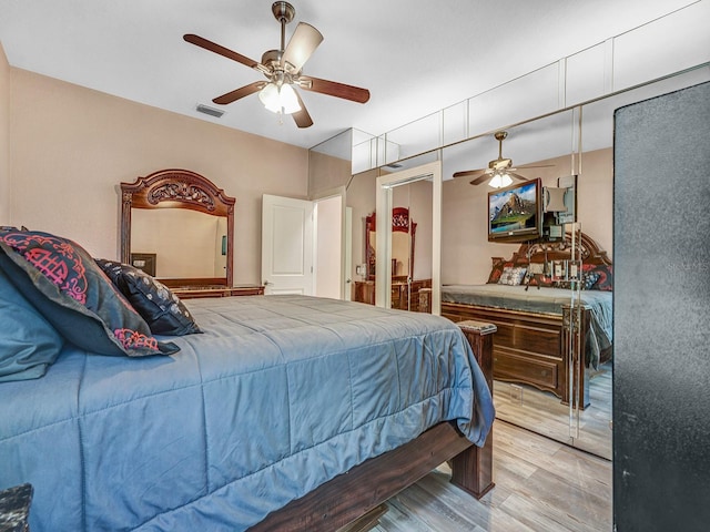 8711 Crescent Forest Blvd, New Port Richey, FL 34654 - bedroom featuring light wood-type flooring and a ceiling fan