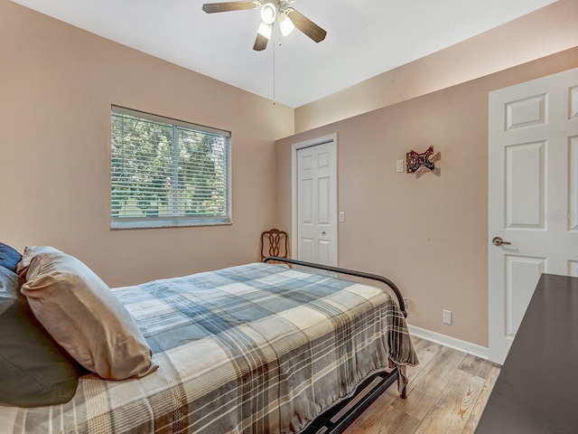 8711 Crescent Forest Blvd, New Port Richey, FL 34654 - bedroom featuring light wood-style floors and ceiling fan