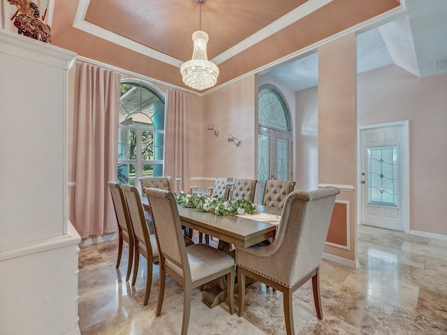 8711 Crescent Forest Blvd, New Port Richey, FL 34654 - dining space with a chandelier and ornamental molding