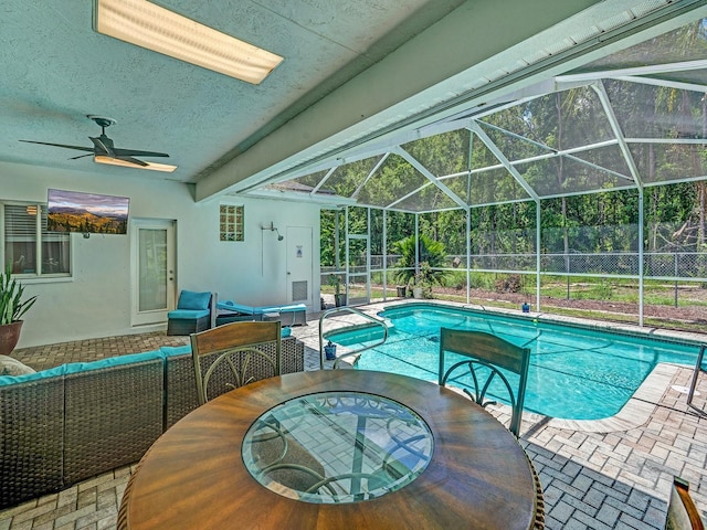 8711 Crescent Forest Blvd, New Port Richey, FL 34654 - view of pool with outdoor lounge area, ceiling fan, a patio area, and a lanai