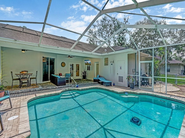 8711 Crescent Forest Blvd, New Port Richey, FL 34654 - outdoor pool featuring a patio, ceiling fan, french doors, and a lanai