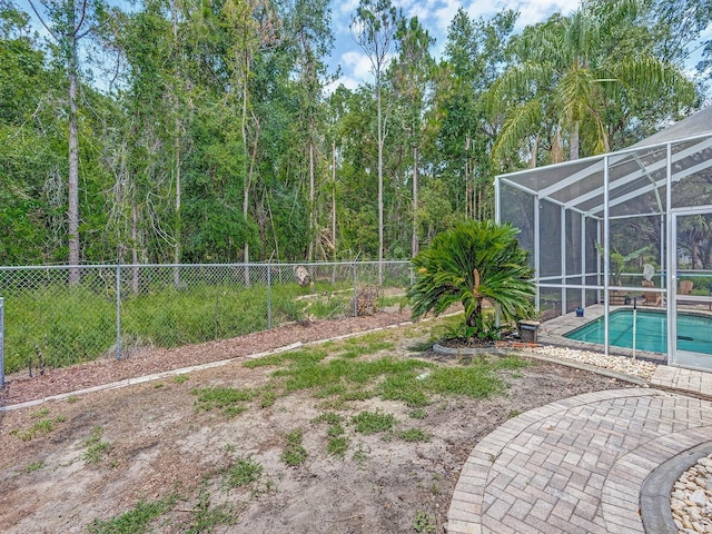 8711 Crescent Forest Blvd, New Port Richey, FL 34654 - view of yard featuring glass enclosure